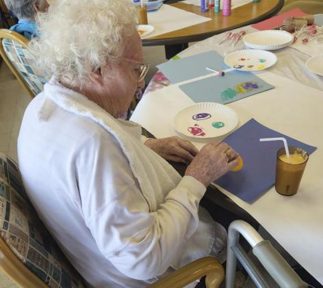 Minnie Mary Hamilton working on her sponge art.