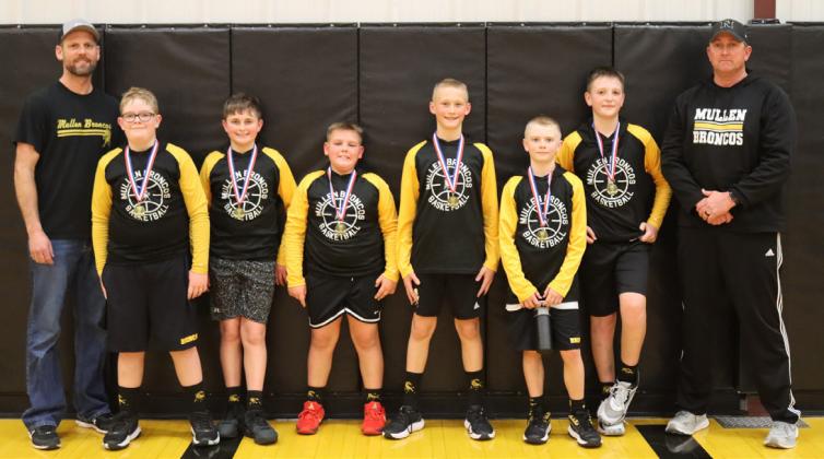 Out of the 6 teams competing in the Hoops in the Hills 5th/6th grade boys division at the Hilltop Gym last Saturday afternoon, the championship game came down to Broncos vs Broncos with the 6th grade team facing off with the 5th grade team. The 6th graders came out on top. Pictured l-r: Coach Garrett Ourada, Collin Donohoe, Bronx Burney, Carson Hegland, Teal Peterson, Weston Ourada, Hayden Deibler, Coach Clint Burney. Gerri Peterson