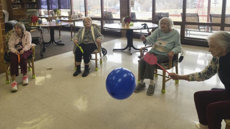 L-r: Sharon Carson, Mary Kemp, Marty Boyer and Wanda Mackley playing flyswatter tennis.