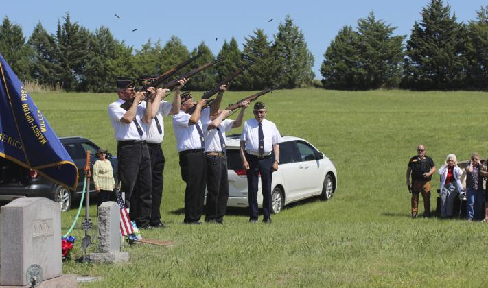 Gerri Peterson Shell casings fly during the American Legion Post #109’s gun salute at the final tribute on Memorial Day at the Cedarview Cemetery. Firing squad pictured l-r: George Jenkins, Ted Bonesteel, Don Younkin, Daryl Starr, Marvin Cox.