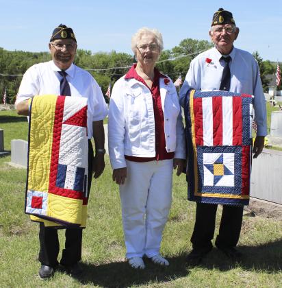 Don Younkin (left) and Lynn Nichols with Doris Starr who made their Quilts of Valor they received on Memorial Day. Gerri Peterson