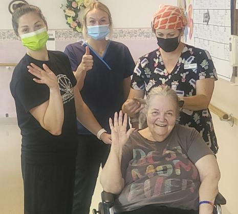 Ann Connell is such a great sport. L-r: CNAs Kelsey Pettit, Lindey Coble and Amanda Vinton were trying a new braid on her hair while Ann was waiting for her daughter’s visit. Ann has beautiful hair.