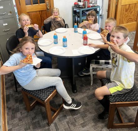 L-r around the table: Sadie Hoyt, Ayden Lee, Charlotte Connealy, Nora Pohot, Finnegan Connealy, Tripp Jewell. Brett Mauler
