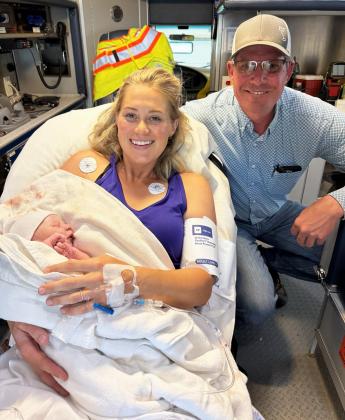 Jais and Jed Connealy with their newborn son Teddy who was born on Highway 2 in the Litchfield ambulance. courtesy photo