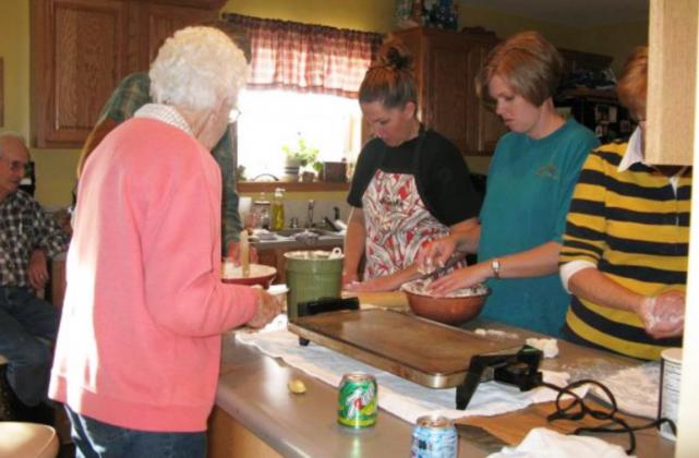 The late Beth Harding gives instructions on how to make lefse to her granddaughters Jennifer Peters (center) and Mary Jo Walker in 2009.
