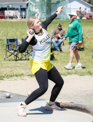 Hayley Donohoe throws the shot put last Friday in Arnold.