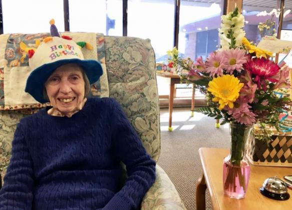 Sharon Carson with her beautiful flowers for her birthday.