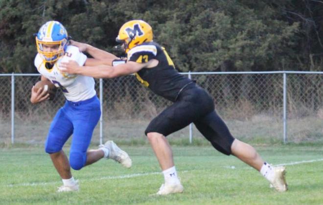 Sean Simonson with a quarterback sack last Friday night. Gerri Peterson