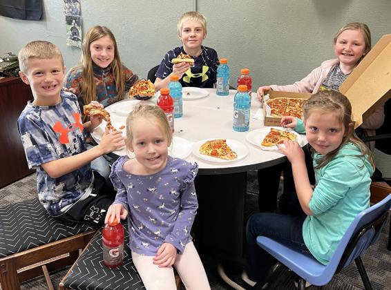 Pictured clockwise around the table from far left: Ryden Ourada, Olivia Cox, Jedd Kraus, Tatum Deibler, Aislynn Connealy, Aurora Polt. Brett Mauler
