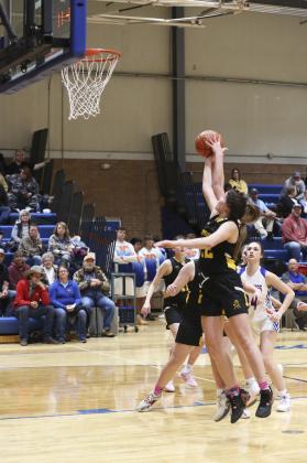 Medora DeNaeyer fights for a rebound at Gordon. Megan Andersen