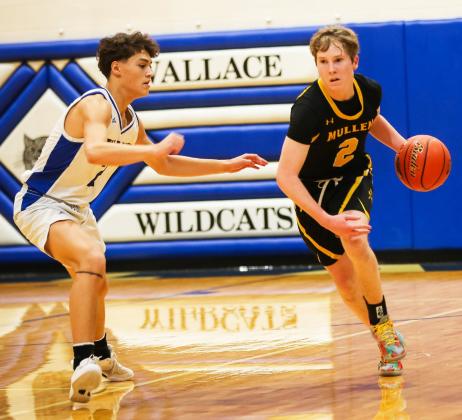Brandon Hardin brings the ball up the court at Wallace. Megan Andersen