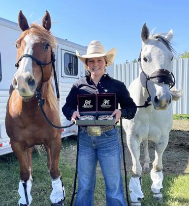 Emerson Thorberg with her National qualifier belt buckles. Kendra Thorberg