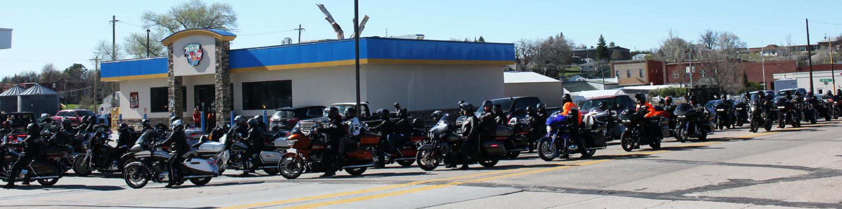 The riders didn’t even have to get off their bikes, as their gas was pumped for them at all four Kwik Stop pumps one after another.