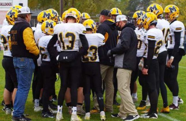 Head Coach Wade Marsh talks to his team during a time out last week at Pleasanton. Barb McIntosh