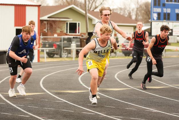 Daniel Wright hands off the baton to D.J. Coetzee during the 4x100 Throwers Relay in Arnold. Megan Andersen