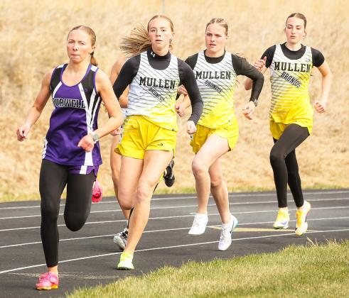 Lady Bronco 800 runners on the first corner, l-r: Harper Andersen, Brynne McCully, Abigail Gracey.