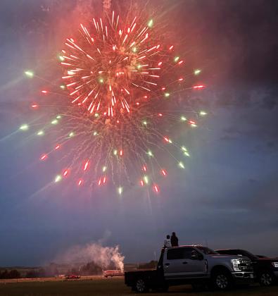 Sisters Abigail and Luciana Gonzalez take in the Mullen fireworks on the 4th of July. The display was funded by Hooker County Lodging Tax. Any donations received for the fireworks go into the Mullen Fun Days bank account. Gerri Peterson
