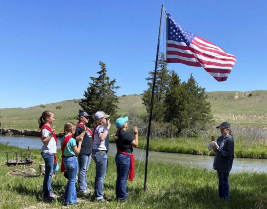 A flag ceremony at Girl Scout Day Camp. Sooky Marks