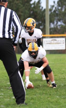 Center Daniel Wright ready to snap the ball to Bo Pettit, Jr. at Wynot last Friday. Carolee Brown Photography
