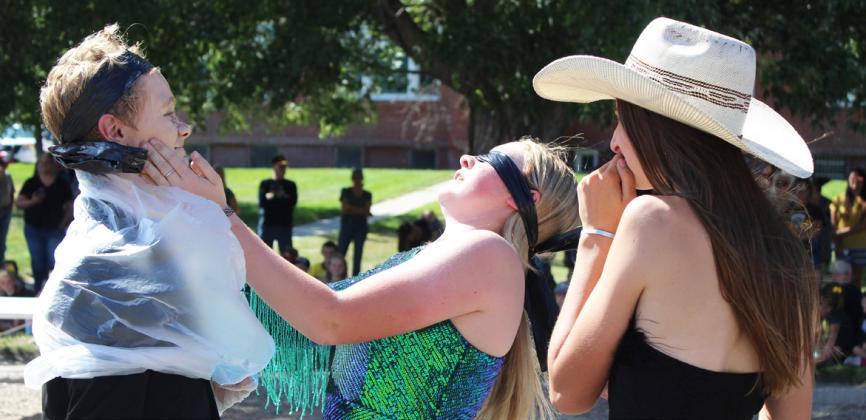 8th graders Cody Walker, Kassidy Cheever and Abby Gracey competing in the makeup artist game at last Friday’s pep rally where the artist was blindfold!