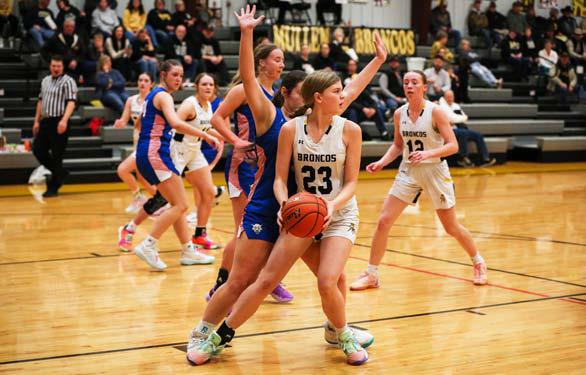 Chloe Newman looks to pass to a teammate during the Arthur game last week. Megan Andersen