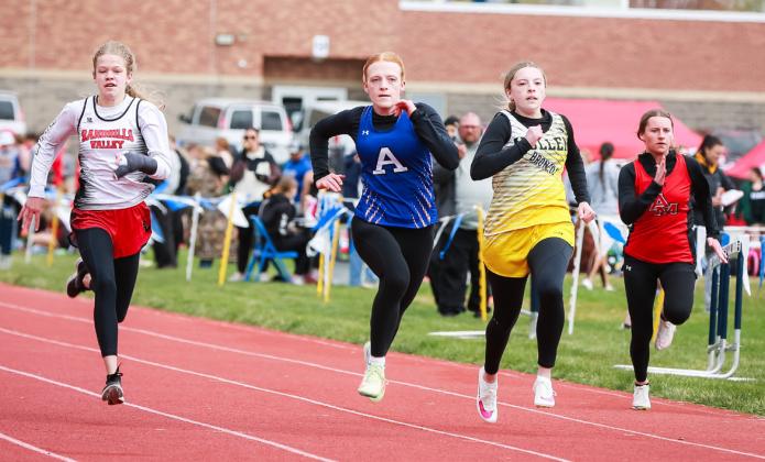 Izzy Hoyt competing in the 100 in Paxton.