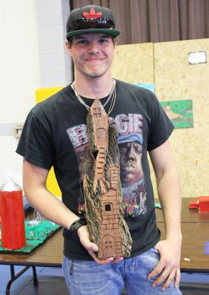 MHS senior Chase Rundback with his first place 3D Art piece, Gnome House.