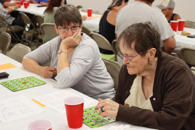 Sisters Eva Crawford and Jo Robinson playing Bingo. Gerri Peterson