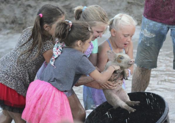 L-r - Zandra Hebbert, Finley Mundorf, Tatum Deibler and Daryl Deibler - Pig Wrestling.