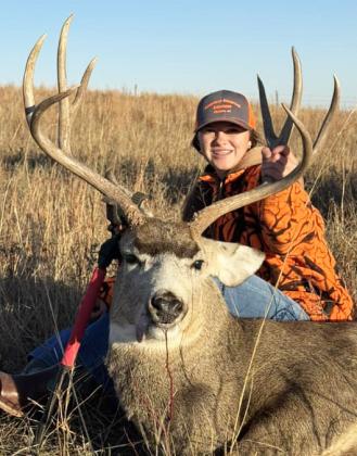 Adalena Hampton with her muley during rifle season.