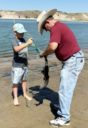 Zach Hicks fishing with Pops Cecil Coons.