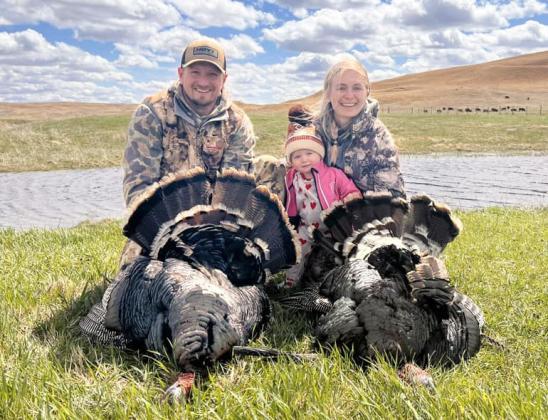 Brett, Aven and Shelby Mauler with their spring turkeys.