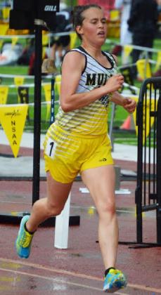 Callie Coble runs to the gold medal in the rain during the girls 3200 at State Track