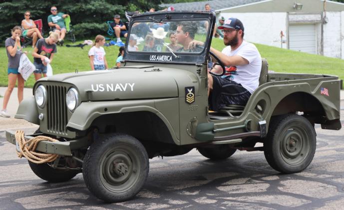 Scott and Hunter Gray driving Ted Bonesteel’s ‘59 Jeep CJ5.