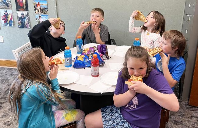 Clockwise around table from back left: Cooper Cash, Gus Wingebach, Nora Pohot, Kayden Evans, Kaleah Heaton, Abbigail Mundorf. Brett Mauler