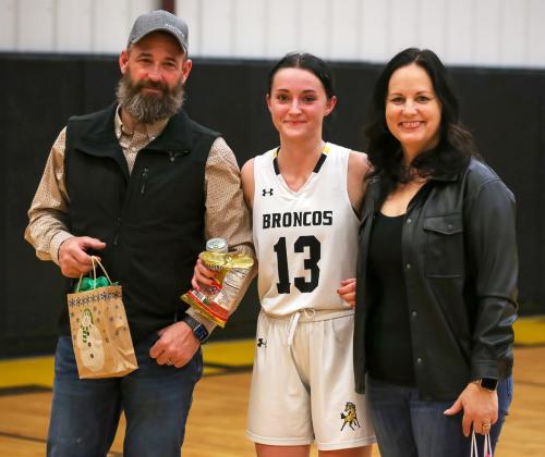 Senior Fayth Brown with her parents, Matt and Carolee, during Senior Parent Night last Friday. Megan Andersen