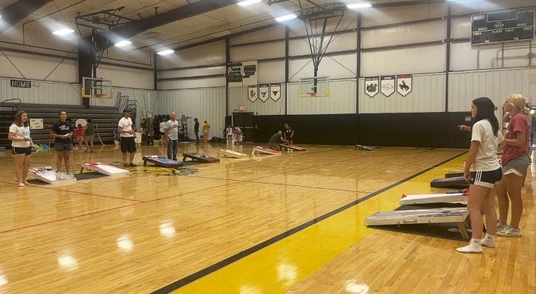 Part of the cornhole tournament in action, with Chris Kuncl and Kyle Bloom named the champions.