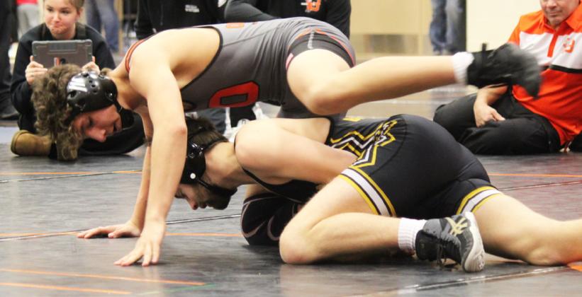 Seniors Jarren Forsen (top photo) and Jacob Wingebach compete in Ogallala last Saturday. Kris Forsen