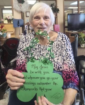 Marlene Dykes showing the March door decorations made by the Sandhills Community Bible Church. Thank you!