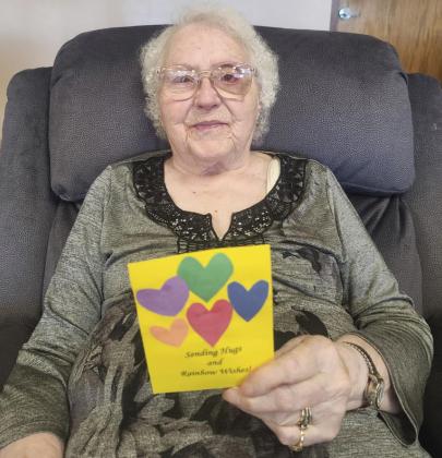 Minnie Mary Hamilton showing the cute decorations that Stacie Adam, RN, and her boys Braxton and Kyson made for the residents - thank you!