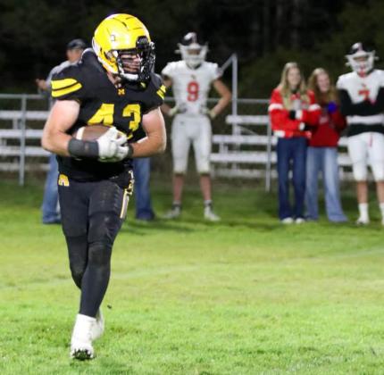 Jason Kraus carries the ball against Sandhills Valley last Friday. Carolee Brown Photography
