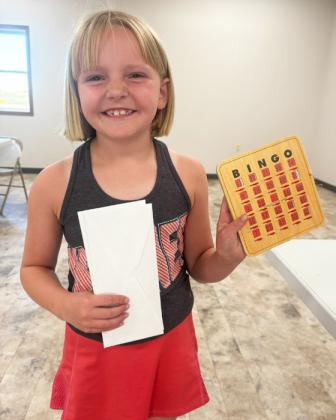 Ryann Walz (right) was the big winner of Bingo last Friday evening during alumni festivities at the Hooker County Community Center. She not only won $20 by winning one game of Bingo, but she also won $40 by winning the final game of blackout! Gerri Peterson
