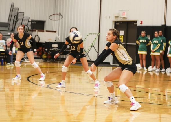 Lauren Schoonveld with a dig against North Platte St. Pat’s. Megan Andersen