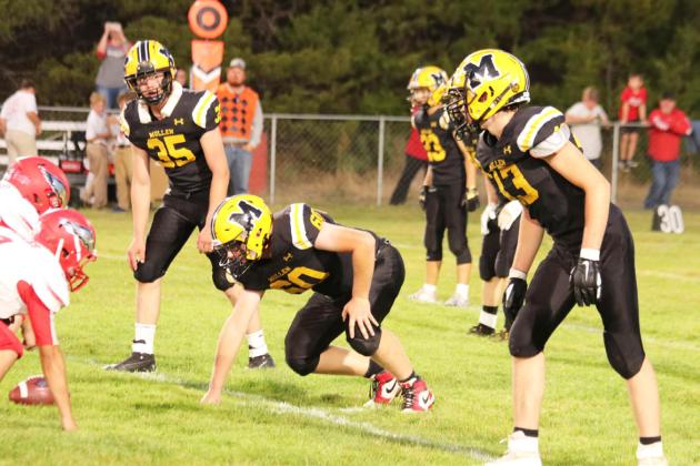 L-r: Cooper Walker, Daniel Wright and Jaylon Forsen on defense last Friday against Brady. Carolee Brown