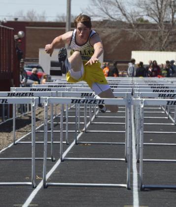 Above: Chase Gracey competes in the 110 hurdles on April 11 in Arnold. Right: Mercedes Garner in shot put action also in Arnold. Bri Moore