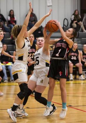 Lauren Schoonveld and Samantha Cheever defend a Maverick. Megan Andersen