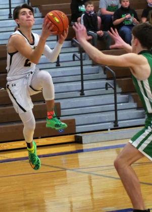 Trevor Kuncl drives to the basket against FCSH. Barb McIntosh