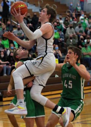 Jaden Emerson drives to the basket against FCSH. Barb McIntosh