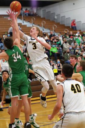 Clayton Moore puts up a shot against Falls City Sacred Heart. Barb McIntosh