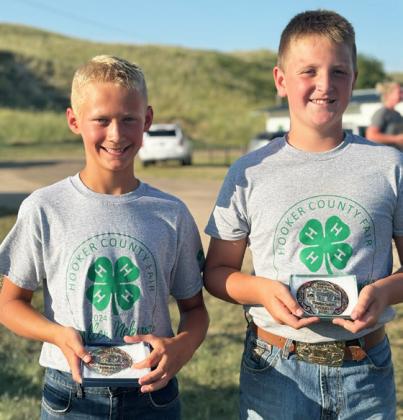 L-r: Teal Peterson - Overall Swine Grand Champion and Hayden Deibler - Overall Beef Grand Champion.